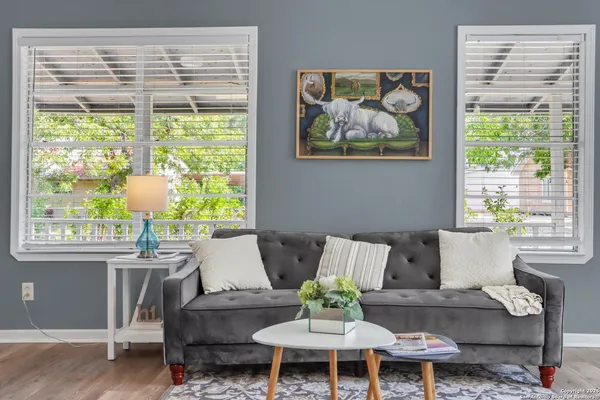 a living room with furniture and a large window