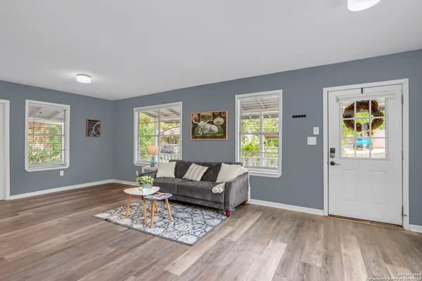 a living room with furniture and a window