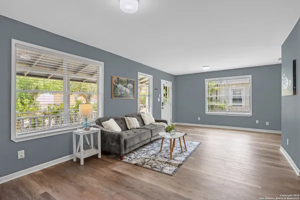 a living room with furniture and a large window