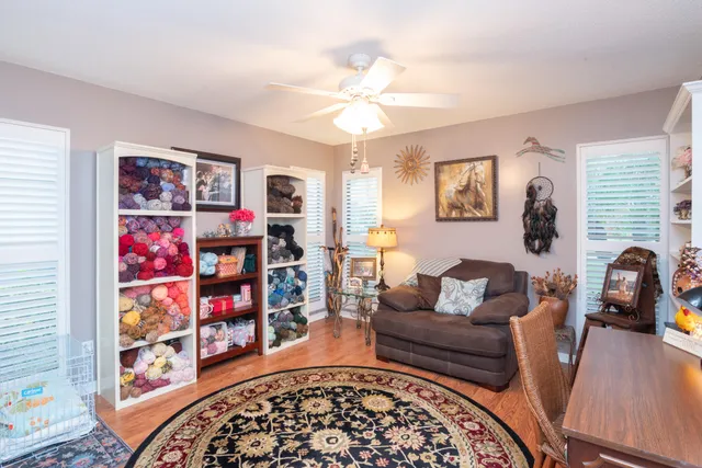 a view of a dining room with furniture and a chandelier