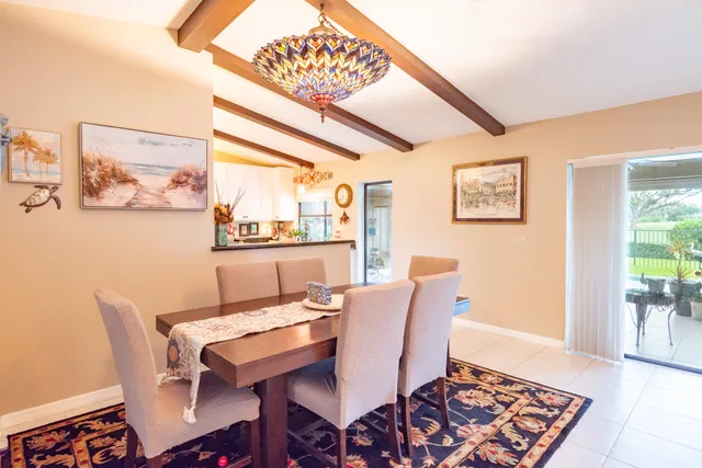 a bedroom with a bed and painting on the wall