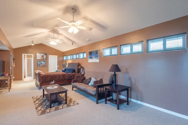 a view of a house with swimming pool and sitting area