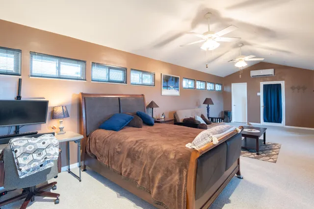 aerial view of a house with a yard and garden