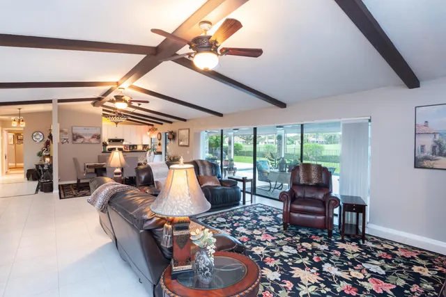 a bedroom with a bed and dresser with mirror