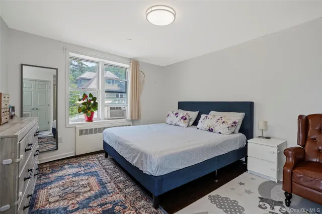 a bedroom with a large bed and a couch