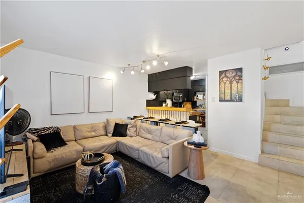 a kitchen with stainless steel appliances a stove cabinets and a sink