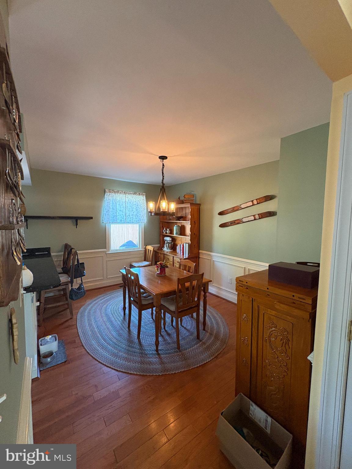 225 East 5th Street Frederick, MD 21701 - Photo 11 of 20 a living room with furniture and a chandelier