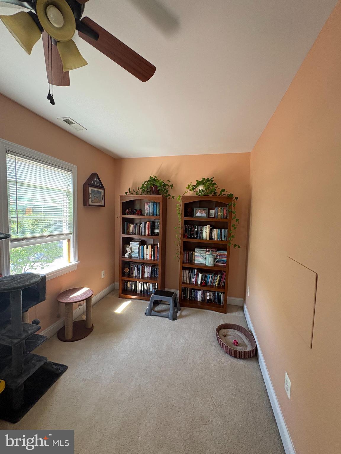 225 East 5th Street Frederick, MD 21701 - Photo 15 of 20 a room with furniture and a book shelf