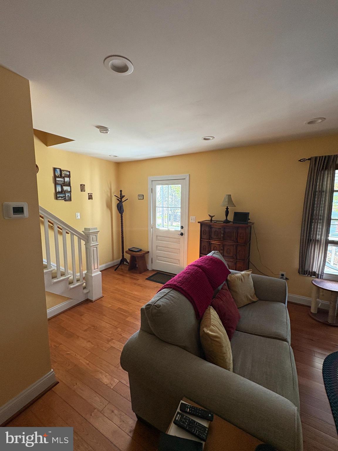 225 East 5th Street Frederick, MD 21701 - Photo 4 of 20 a living room with furniture and a window