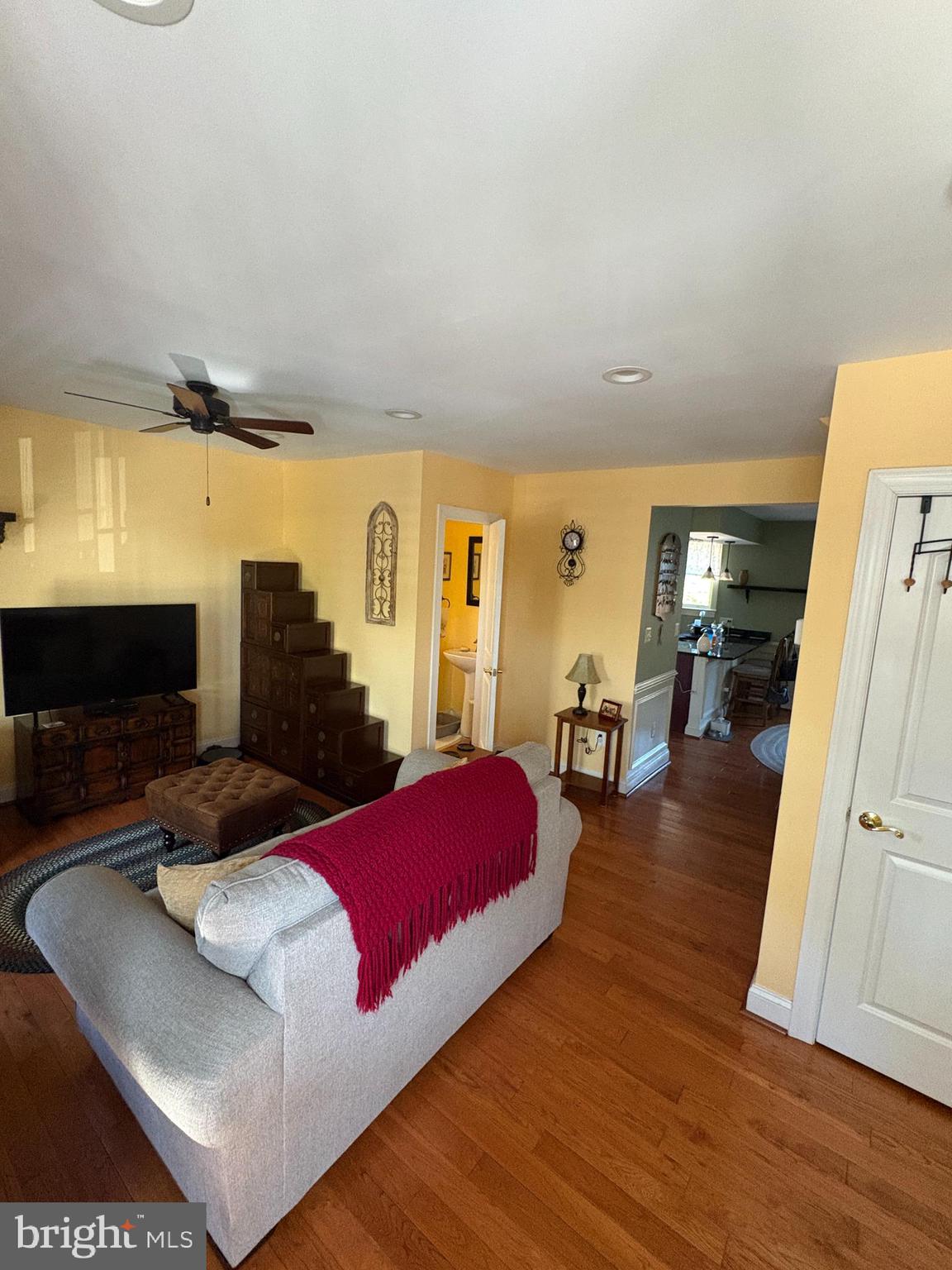 225 East 5th Street Frederick, MD 21701 - Photo 8 of 20 a living room with furniture and a flat screen tv