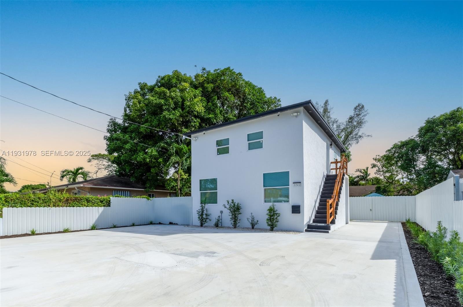 2242 Northwest 64th Street Miami, FL 33147 - Photo 1 of 16 a view of a house with a outdoor space