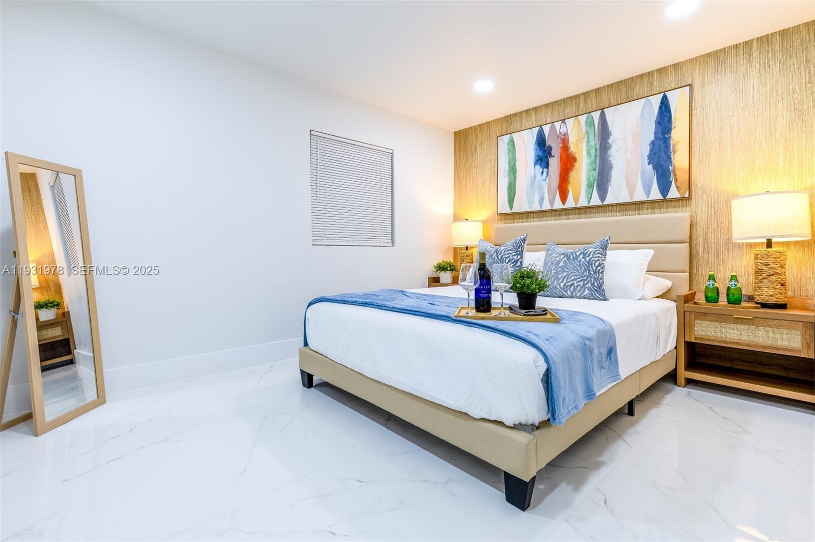 2242 Northwest 64th Street Miami, FL 33147 - Photo 11 of 16 a bed room with a bed and a painting on the wall