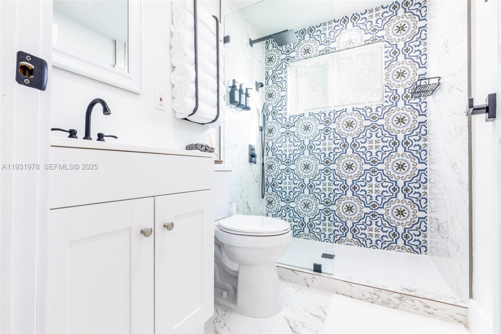 2242 Northwest 64th Street Miami, FL 33147 - Photo 15 of 16 a bathroom with a sink toilet and shower