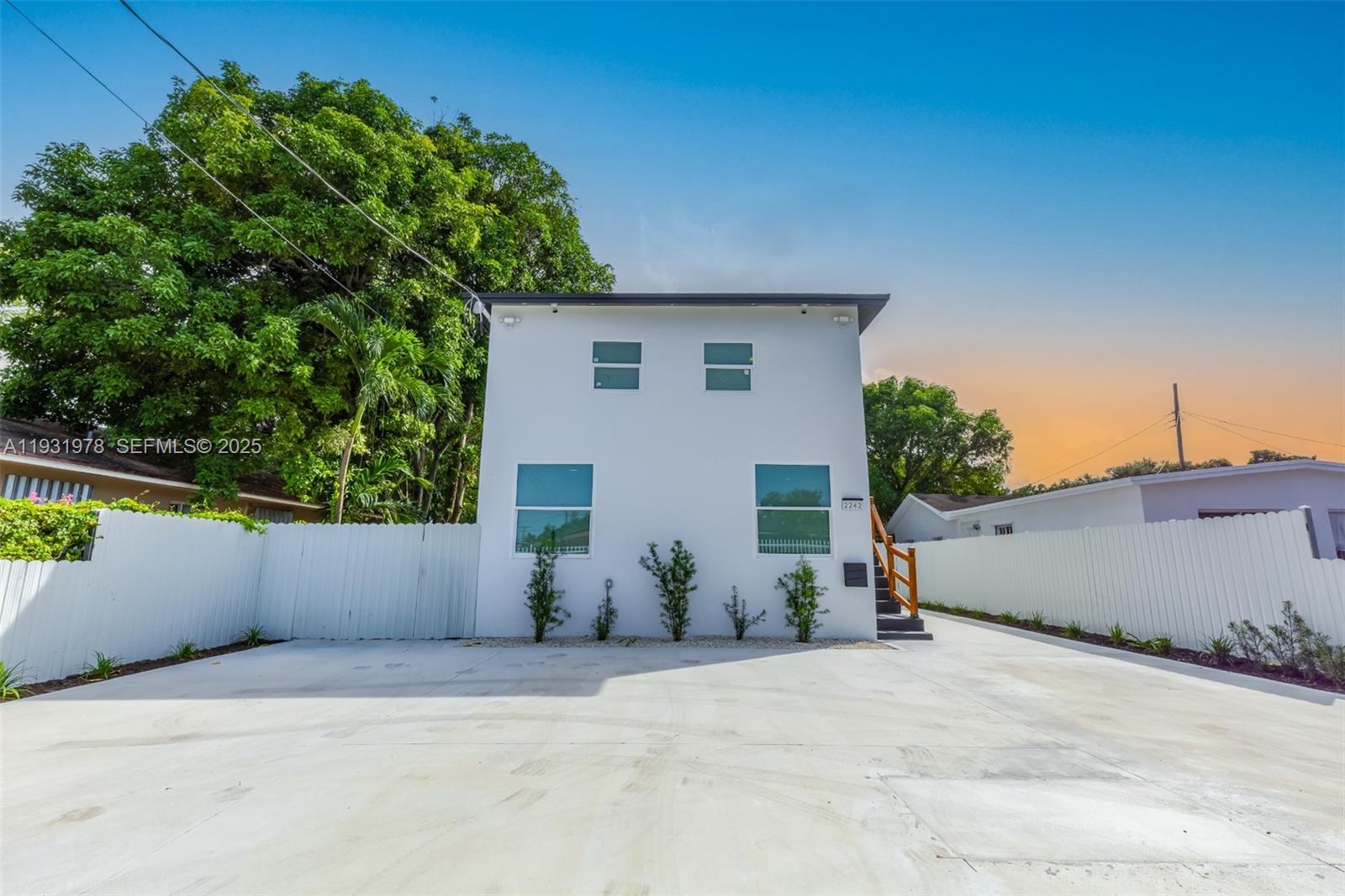 2242 Northwest 64th Street Miami, FL 33147 - Photo 2 of 16 front view of a house with a yard