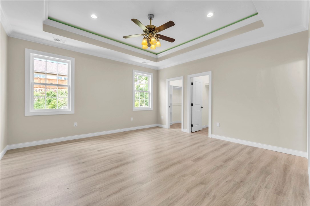 1015 Winmar Drive Anderson, SC 29621 - Photo 20 of 49 This spacious bedroom offers ample natural light and a stylish ceiling fan with recessed lighting.