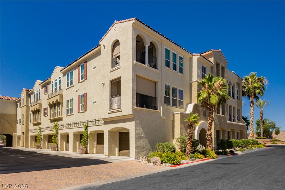 2555 Hampton Road, Unit 3308 Henderson, NV 89052 - Photo 2 of 65 Mediterranean-inspired multi-story residence with multiple balconies and integrated garages.