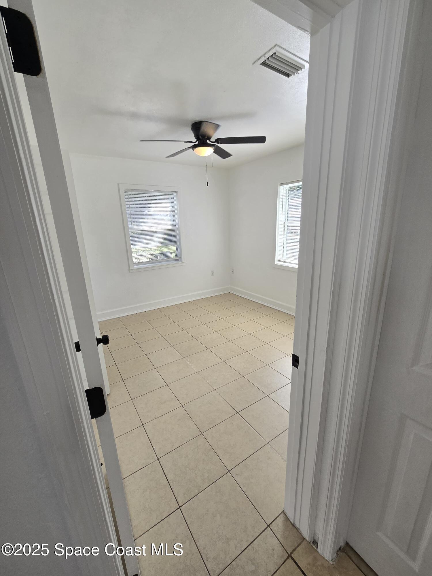 513 North Georgia Avenue Cocoa, FL 32922 - Photo 12 of 20 a view of an empty room and a window