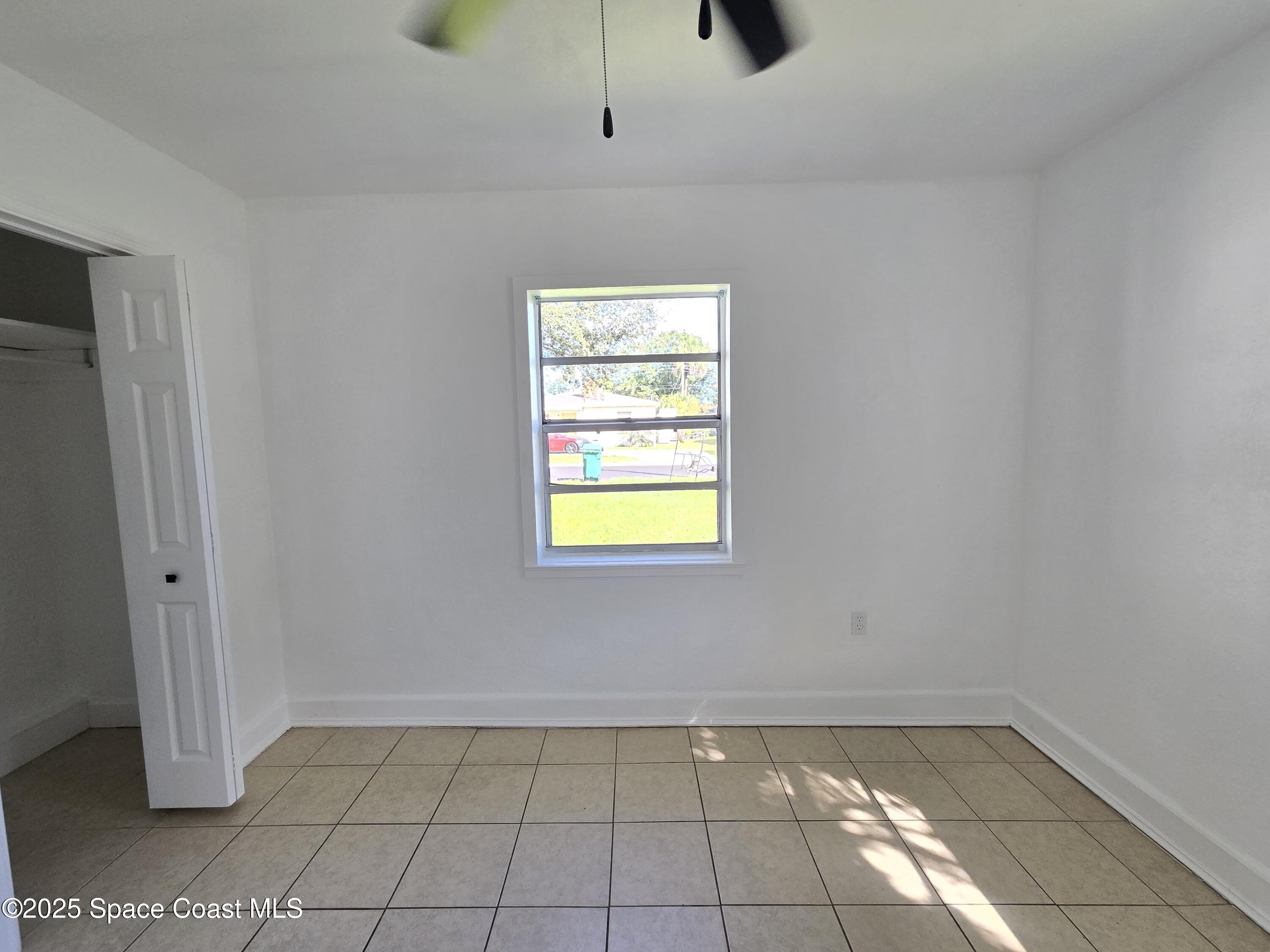 513 North Georgia Avenue Cocoa, FL 32922 - Photo 16 of 20 a view of an empty room and window