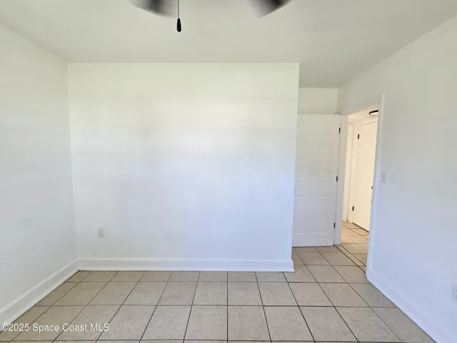 a white toilet sitting next to a bathroom sink and tub