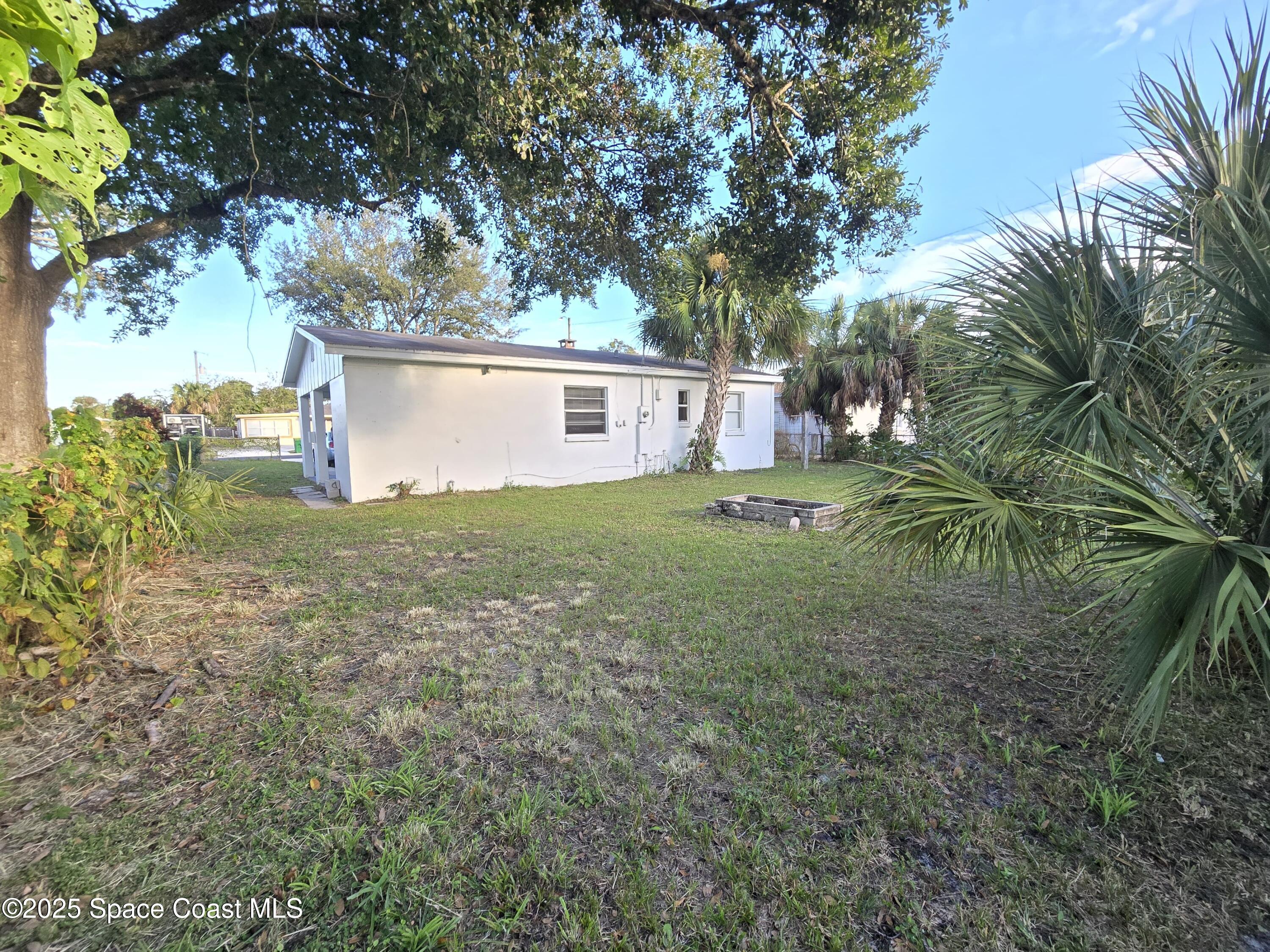 513 North Georgia Avenue Cocoa, FL 32922 - Photo 19 of 20 a house view with a garden space