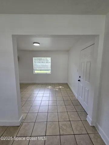 a view of an empty room and window