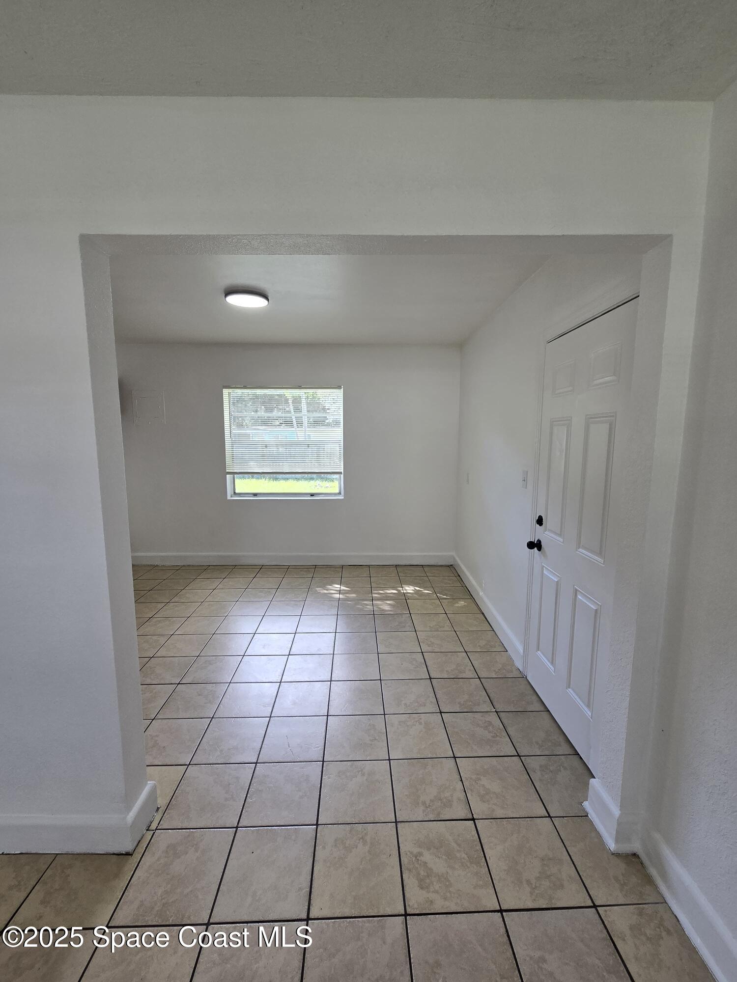 513 North Georgia Avenue Cocoa, FL 32922 - Photo 8 of 20 a view of an empty room and window