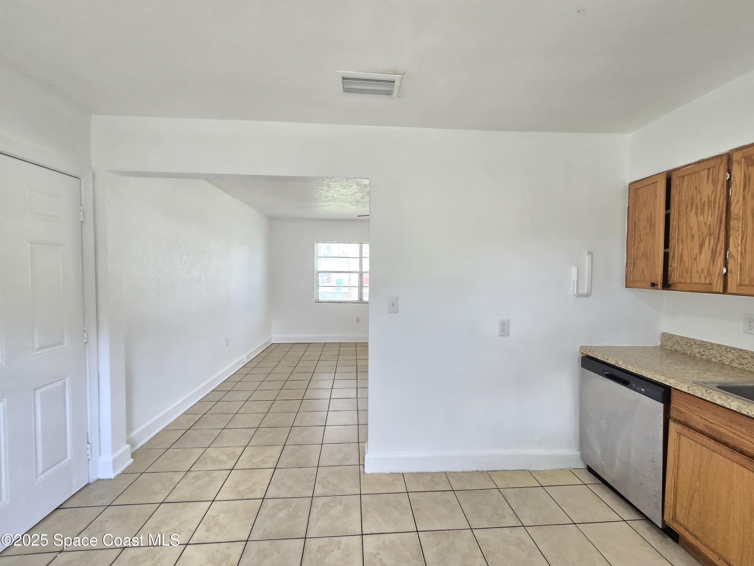 513 North Georgia Avenue Cocoa, FL 32922 - Photo 9 of 20 a view of a kitchen space with windows