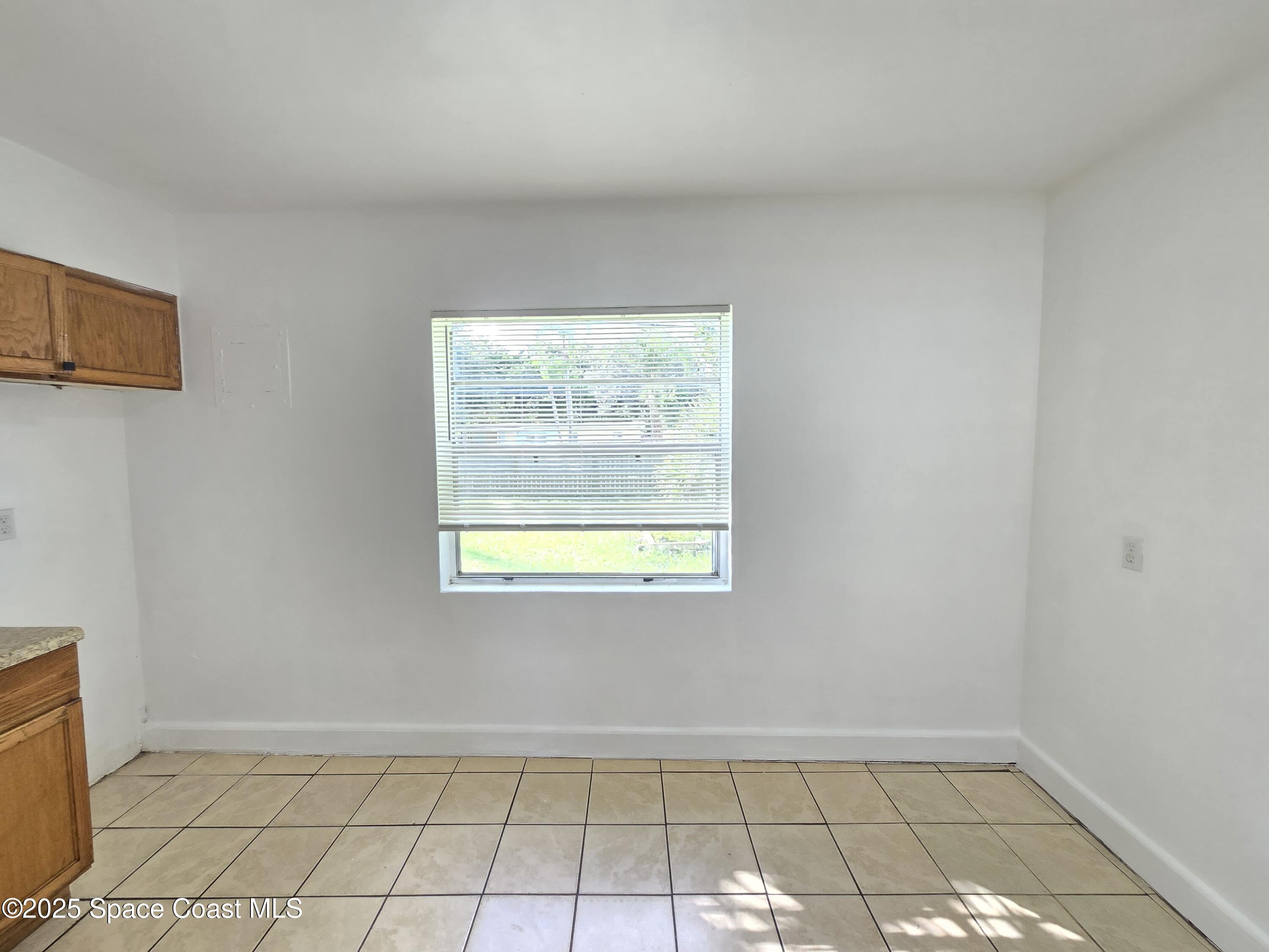 513 North Georgia Avenue Cocoa, FL 32922 - Photo 10 of 20 an empty room with windows