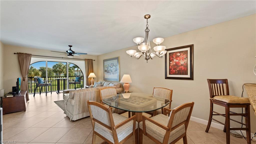 45 High Point Circle South, Unit 304 Naples, FL 34103 - Photo 6 of 20 a view of a dining room with furniture window and outside view