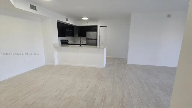 a view of kitchen and kitchen with sink