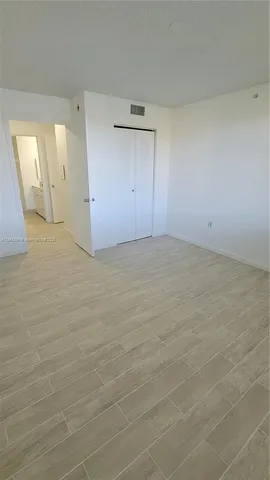 a view of a bathroom with sink and washing machine