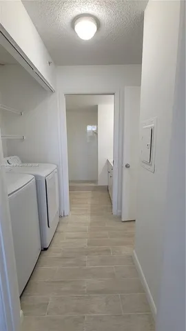 a bathroom with a toilet a sink and bathtub