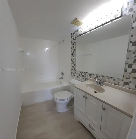 a bathroom with a double vanity sink and mirror