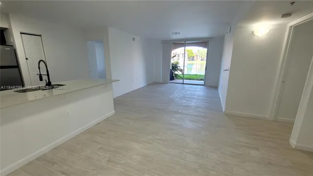 a view of a hallway with a window