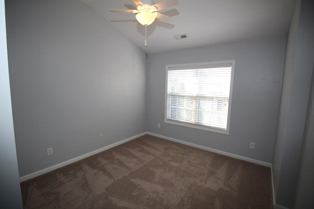 6952 Middleboro Drive Raleigh, NC 27612 - Photo 20 of 32 Upstairs spare bedroom #2 with vaulted ceiling. Bedroom