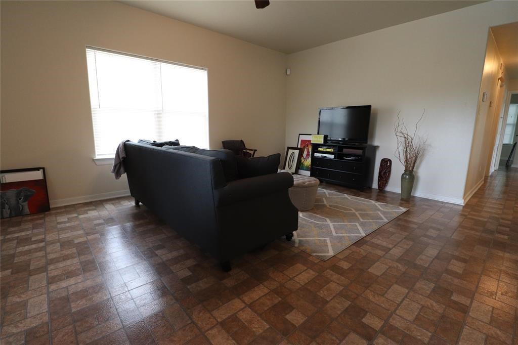 1513 Cage Street, Unit A Houston, TX 77020 - Photo 2 of 17 a living room with furniture and a flat screen tv