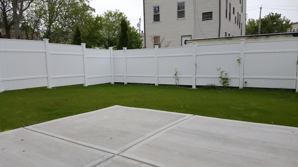 25 Robey Street, Unit 25 Boston, MA 02119 - Photo 11 of 13 a view of a backyard with cabin