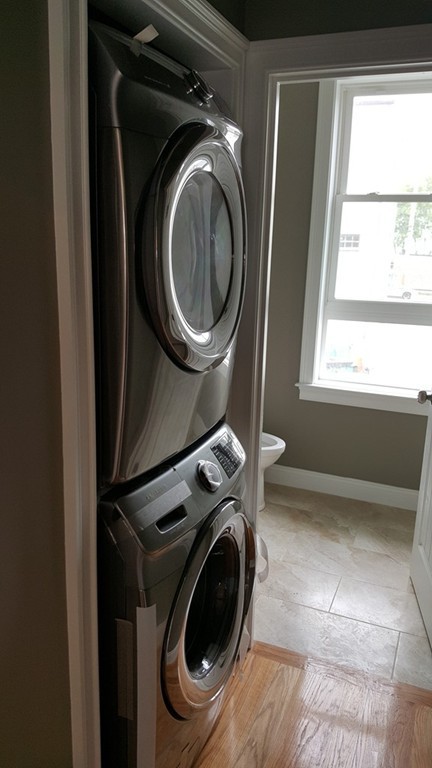25 Robey Street, Unit 25 Boston, MA 02119 - Photo 8 of 13 a utility room with dryer and washer