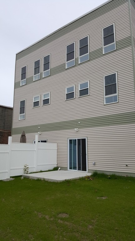 25 Robey Street, Unit 25 Boston, MA 02119 - Photo 10 of 13 a view of house with backyard