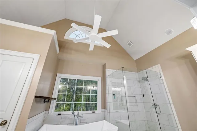 a view of a house with swimming pool and sitting area