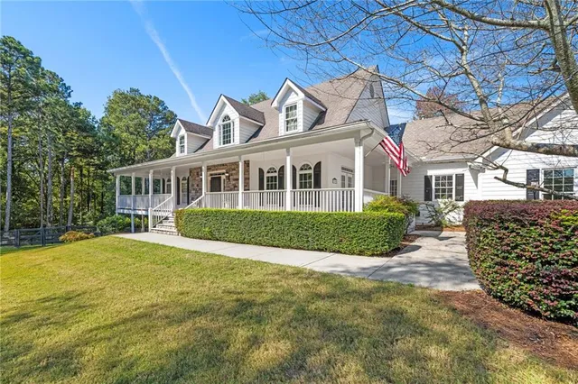 a view of living room kitchen with furniture and fireplace