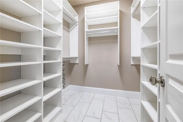 a view of a room with wooden floor and iron stairs