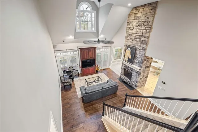a view of a swimming pool with a patio and a yard
