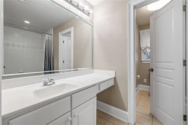 a view of a porch with wooden floor and iron stairs
