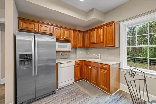 a view of backyard with green space and deck