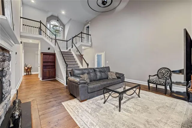 a view of a dining room with furniture wooden floor and chandelier