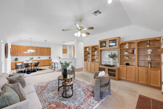 a living room with furniture or couch and a large window
