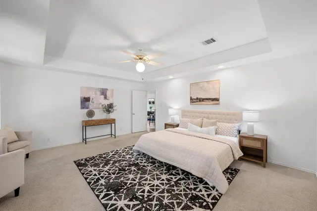 a bedroom with a bed and a table