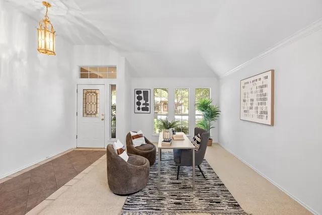a living room with furniture and a rug