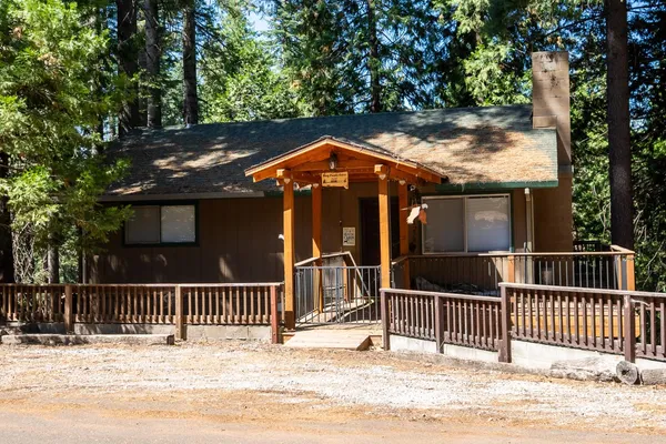 a front view of a house with a fence